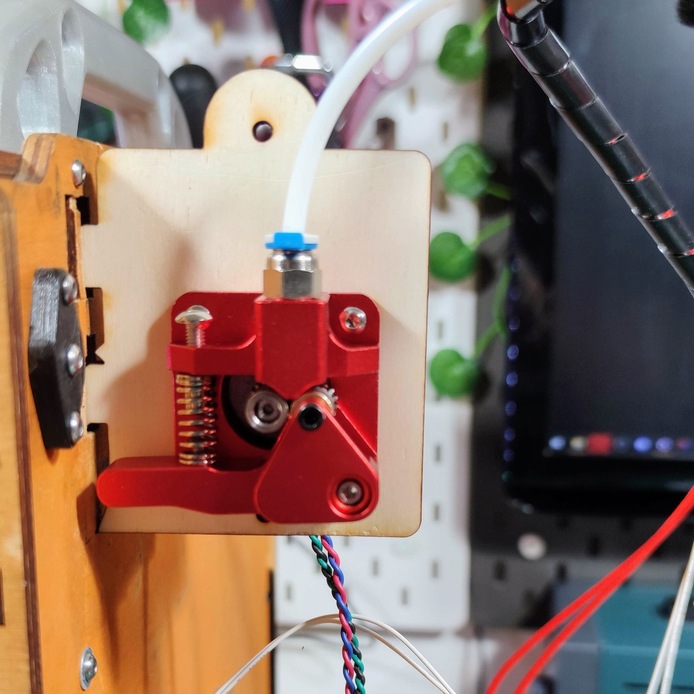 The extruder on its motor